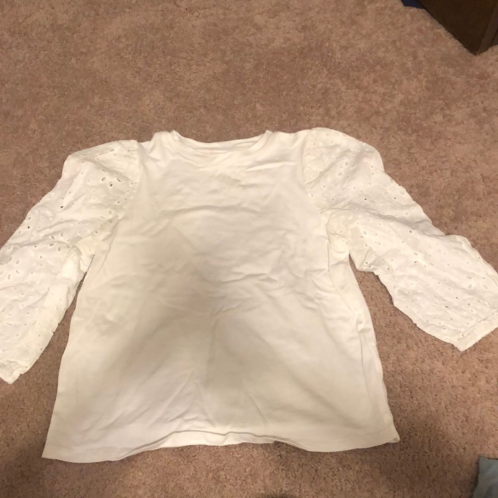 White dressy top with small makeup stain